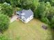 Aerial view of home with large manicured lawn and firepit at 1062 Willow Ridge Ln, Fort Mill, SC 29707