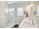 Bathroom features a glass-enclosed shower with marble tile, double vanity sinks, and modern fixtures at 1062 Willow Ridge Ln, Fort Mill, SC 29707