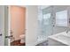 Updated bathroom offers a glass-enclosed shower with marble tile, a vanity, and a separate toilet room at 1062 Willow Ridge Ln, Fort Mill, SC 29707