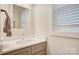 A well-lit bathroom with a stylish vanity, modern fixtures, and a large window at 1062 Willow Ridge Ln, Fort Mill, SC 29707