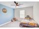 Cozy bedroom with custom wall accents, a ceiling fan, and natural light at 1062 Willow Ridge Ln, Fort Mill, SC 29707