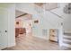 Bright foyer with a staircase and wood accents, leading to the living area and showcasing natural light at 1062 Willow Ridge Ln, Fort Mill, SC 29707