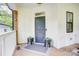 Inviting front porch features a decorative rug and plants at 1062 Willow Ridge Ln, Fort Mill, SC 29707