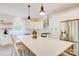 Contemporary kitchen boasts white cabinets, stainless steel appliances, a spacious island, and ample counter space at 1062 Willow Ridge Ln, Fort Mill, SC 29707