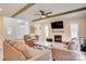 Spacious living room with a fireplace, beamed ceilings, and plenty of natural light at 1062 Willow Ridge Ln, Fort Mill, SC 29707