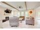 Spacious living room with a fireplace, beamed ceilings, and plenty of natural light at 1062 Willow Ridge Ln, Fort Mill, SC 29707