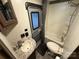 This RV bathroom features a sink with a decorative backsplash, a toilet, and a shower/tub combination at 107 Pine St, New London, NC 28127