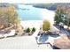 Aerial view of community beach access with playground, building, parking and a beautiful lake at 107 Pine St, New London, NC 28127