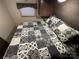Comfortable main bedroom featuring a full size bed, overhead storage, and a cozy atmosphere at 107 Pine St, New London, NC 28127