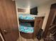 Inside this recreational vehicle are wooden bunk beds with fun 