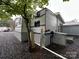 Exterior view of the modular home on lot 204, showing metal siding and a gray gravel driveway at 107 Pine St, New London, NC 28127