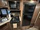 Compact kitchen features modern appliances and plenty of storage for easy meal preparation at 107 Pine St, New London, NC 28127