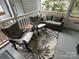 This patio is perfect for relaxing with a couch, chairs, and a small table at 107 Pine St, New London, NC 28127