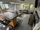 This recreational vehicle has a lovely patio complete with a bar, seating, and a ceiling fan at 107 Pine St, New London, NC 28127
