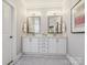 Elegant bathroom features double sinks, large mirrors, and stylish lighting fixtures, with a decorative rug at 1226 Restoration Dr, Waxhaw, NC 28173