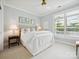 Serene bedroom with natural light from shuttered windows, cozy decor, and calm, pastel colors at 1226 Restoration Dr, Waxhaw, NC 28173