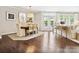 Dining room with an oval table for four and a view of the sitting room and outdoor access at 1226 Restoration Dr, Waxhaw, NC 28173