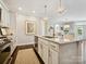 Spacious kitchen island with granite countertops, pendant lighting, and stainless steel dishwasher and range at 1226 Restoration Dr, Waxhaw, NC 28173