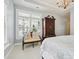 Bright bedroom with natural light from a window, featuring a decorative antique cabinet at 1226 Restoration Dr, Waxhaw, NC 28173