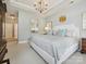 Large main bedroom with a chandelier, lots of space, and views of the hallway at 1226 Restoration Dr, Waxhaw, NC 28173
