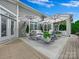 Outdoor patio area featuring elegant furniture, umbrellas, and beautiful lighting for relaxing evenings at 1226 Restoration Dr, Waxhaw, NC 28173
