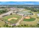 Aerial view of multiple athletic fields and buildings at a nearby school complex at 12910 Meetinghouse Dr, Cornelius, NC 28031