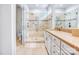 Bathroom features a glass enclosed tile shower and double vanities at 12910 Meetinghouse Dr, Cornelius, NC 28031