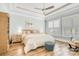 Bright bedroom features natural light, a tray ceiling, and neutral decor at 12910 Meetinghouse Dr, Cornelius, NC 28031