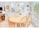 Bright and airy breakfast nook featuring a round wooden table and a lovely view at 12910 Meetinghouse Dr, Cornelius, NC 28031