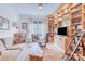 Cozy room with built in bookshelves, comfortable seating, and natural light at 12910 Meetinghouse Dr, Cornelius, NC 28031