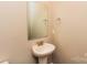 Bathroom featuring a pedestal sink, mirror, and modern faucet and towel rack at 153 Ole Eastpointe Dr, York, SC 29745