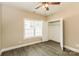Cozy bedroom features ceiling fan, closet with shelves and a window that provides natural light at 153 Ole Eastpointe Dr, York, SC 29745