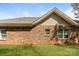 Brick home exterior featuring a well-maintained lawn and traditional double-hung windows at 153 Ole Eastpointe Dr, York, SC 29745
