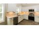 Close-up view of the modern kitchen with stainless steel appliances and bright white cabinets at 153 Ole Eastpointe Dr, York, SC 29745