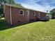 Brick house exterior with a wooden deck overlooking a well-maintained backyard at 1616 Lazenby St # 17, Newton, NC 28658