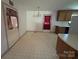 Dining area with tile flooring and cabinets with light countertops at 1616 Lazenby St # 17, Newton, NC 28658
