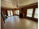 Sunroom featuring multiple windows, tile flooring, a fireplace, and a ceiling fan at 1616 Lazenby St # 17, Newton, NC 28658