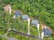 Aerial view of homes, showcasing landscaping, driveways, and natural surroundings at 18238 Youngblood N Rd, Charlotte, NC 28278