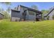 Exterior shot featuring a spacious backyard, a covered patio, and seamless outdoor living at 18238 Youngblood N Rd, Charlotte, NC 28278