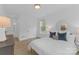 Bright bedroom features a large window and neutral decor at 18238 Youngblood N Rd, Charlotte, NC 28278