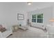 bedroom with a rocking chair, stuffed toys, and white iron bed at 18238 Youngblood N Rd, Charlotte, NC 28278