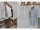 Custom closet with rods and shelves with clothing and shoe storage at 18238 Youngblood N Rd, Charlotte, NC 28278