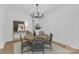 Dining room with wood table and black chandelier, offering an inviting space for meals and gatherings at 18238 Youngblood N Rd, Charlotte, NC 28278