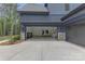 Spacious three-car garage with ample storage space and modern fixtures at 18238 Youngblood N Rd, Charlotte, NC 28278