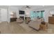 Comfortable living room with a fireplace, large windows, and a neutral color scheme, creating a relaxing atmosphere at 18238 Youngblood N Rd, Charlotte, NC 28278