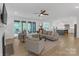 Bright living room with large sliding doors leading to an outdoor space and an open view of the modern kitchen at 18238 Youngblood N Rd, Charlotte, NC 28278