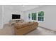 Living room with a beautiful view from the three large windows at 18238 Youngblood N Rd, Charlotte, NC 28278