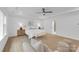 Main bedroom features a vaulted ceiling and light wood floors at 18238 Youngblood N Rd, Charlotte, NC 28278