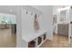 Mudroom featuring a bench with storage, hooks, and light hardwood floors at 18238 Youngblood N Rd, Charlotte, NC 28278