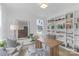 Bright office with built-in bookshelves, a large window, a wood desk, and comfortable seating at 18238 Youngblood N Rd, Charlotte, NC 28278